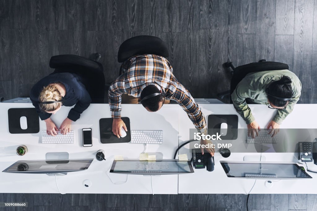High angle shot of a group of call centre agents working in an office
